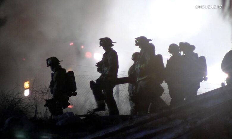 110 freeway closed in both directions in Wilmington for fire near encampment