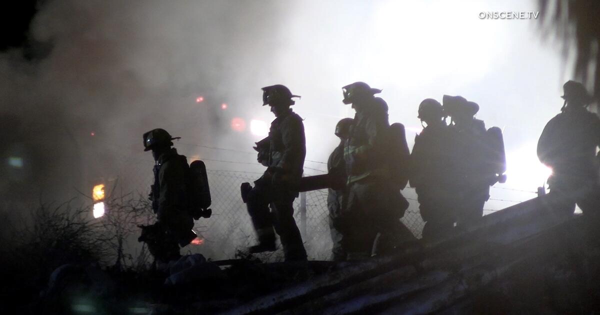 110 freeway closed in both directions in Wilmington for fire near encampment