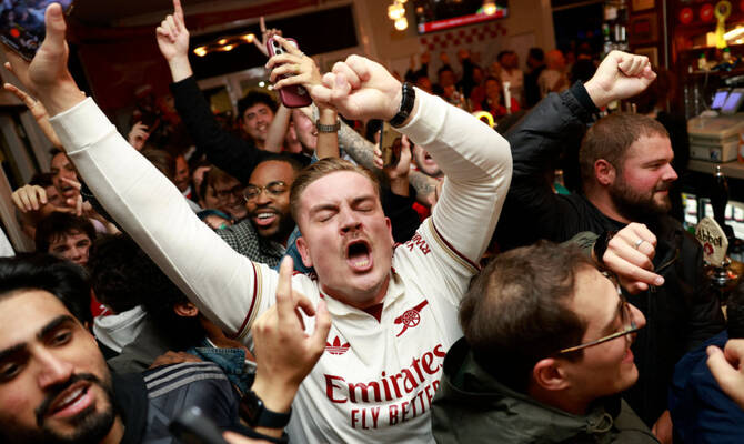 Arsenal wins its first Premier League title in 22 years after Man City draws with Bournemouth
