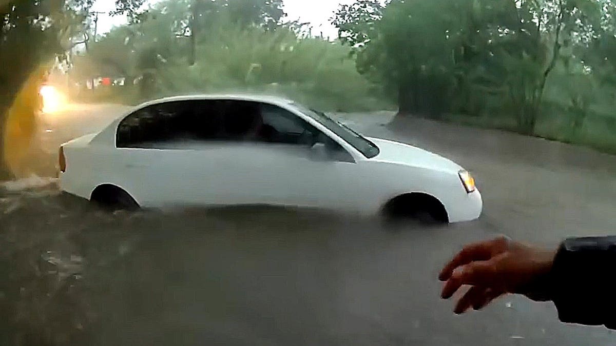 Baby pulled from vehicle trapped in raging floodwaters in dramatic rescue caught on video