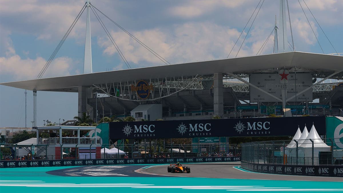 Cameraman gets caught risking it all to film World Cup’s ‘sexiest fan’ in the Formula 1 paddock