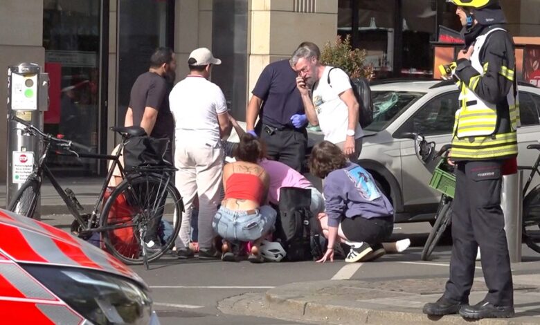 Car plows into pedestrian zone killing 2 as police detain driver and investigate motive