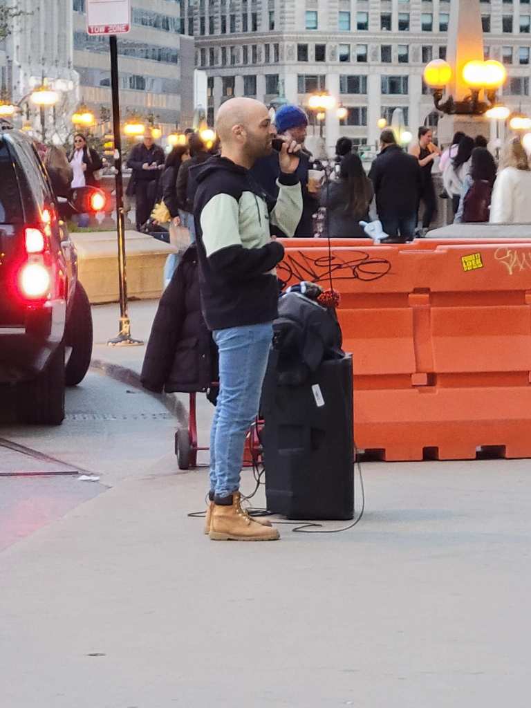 Chicago street performer Andrew David robbed in broad daylight while singing by teen in viral video