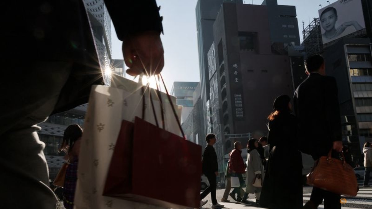 Japan keeps view economy recovering but warns risk from Middle East