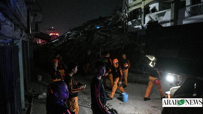 Philippine rescuers racing against time a day after deadly building collapse 