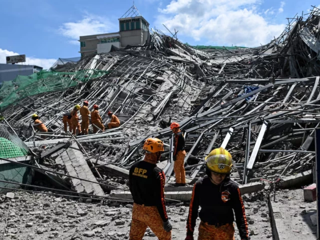 Rescuers search for more than 20 trapped after Philippines building collapse | The Express Tribune