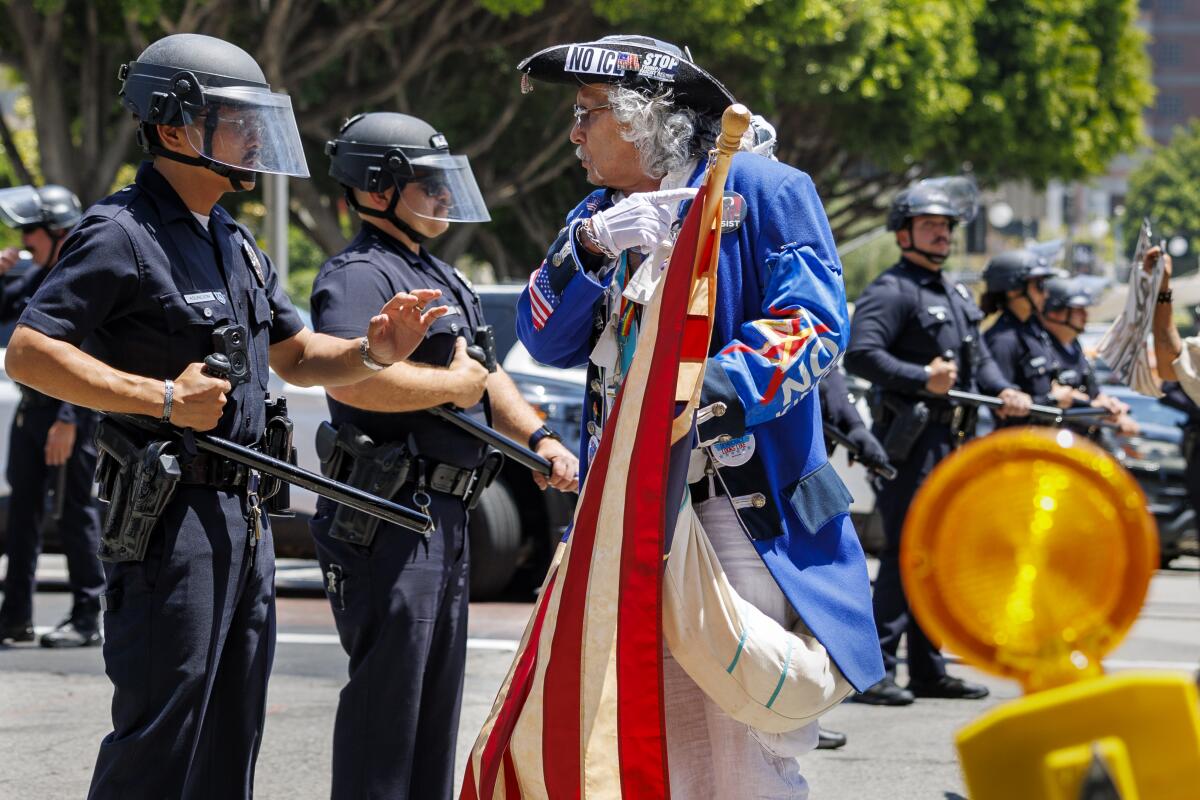 Thousands rally in L.A. for May Day to protest immigration sweeps, high cost of living