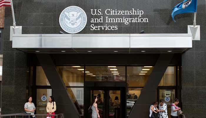 US tells foreigners seeking green cards: Return to your countries to apply