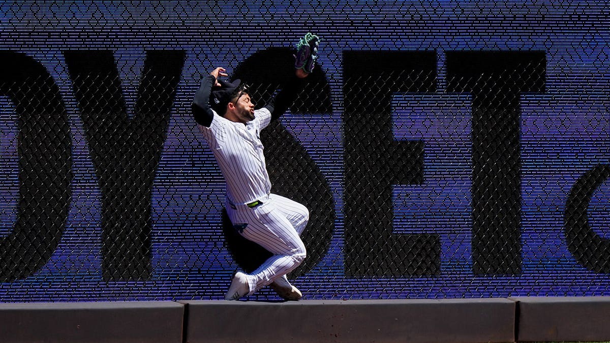 Yankees’ Jasson Dominguez carted off field in tears after crashing into outfield wall after stunning catch